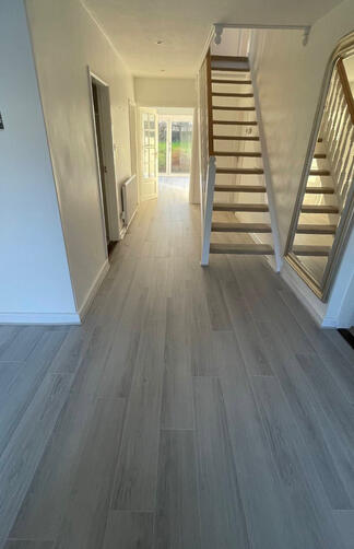 Grey laminate plank hallway Grey laminate plank hallway